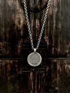 Our handcrafted 925 solid sterling silver etched Coral Compass circle pendant necklace.  The pattern reminds us of old nautical compasses. 