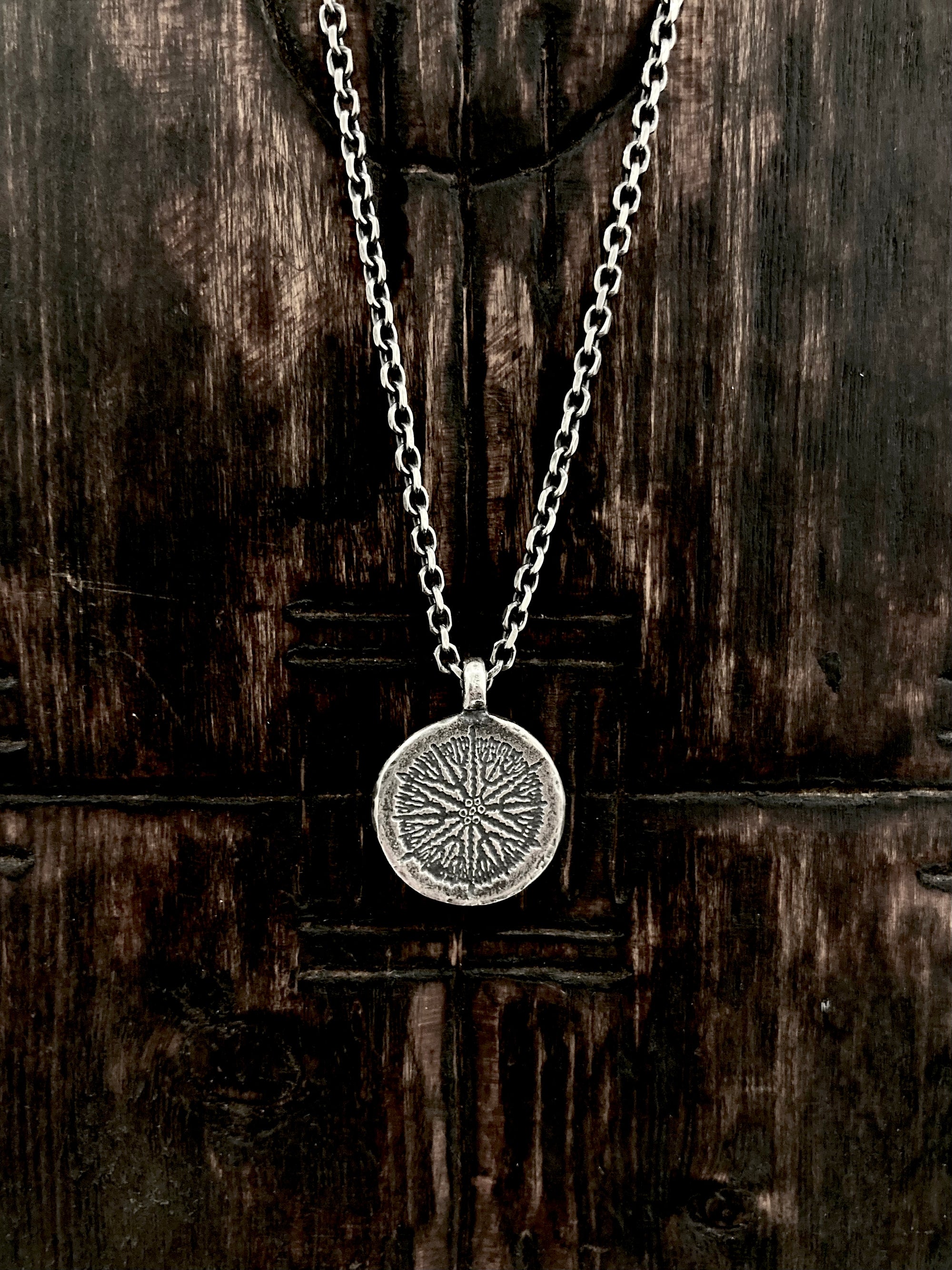 Our handcrafted 925 solid sterling silver etched Coral Compass circle pendant necklace.  The pattern reminds us of old nautical compasses. 