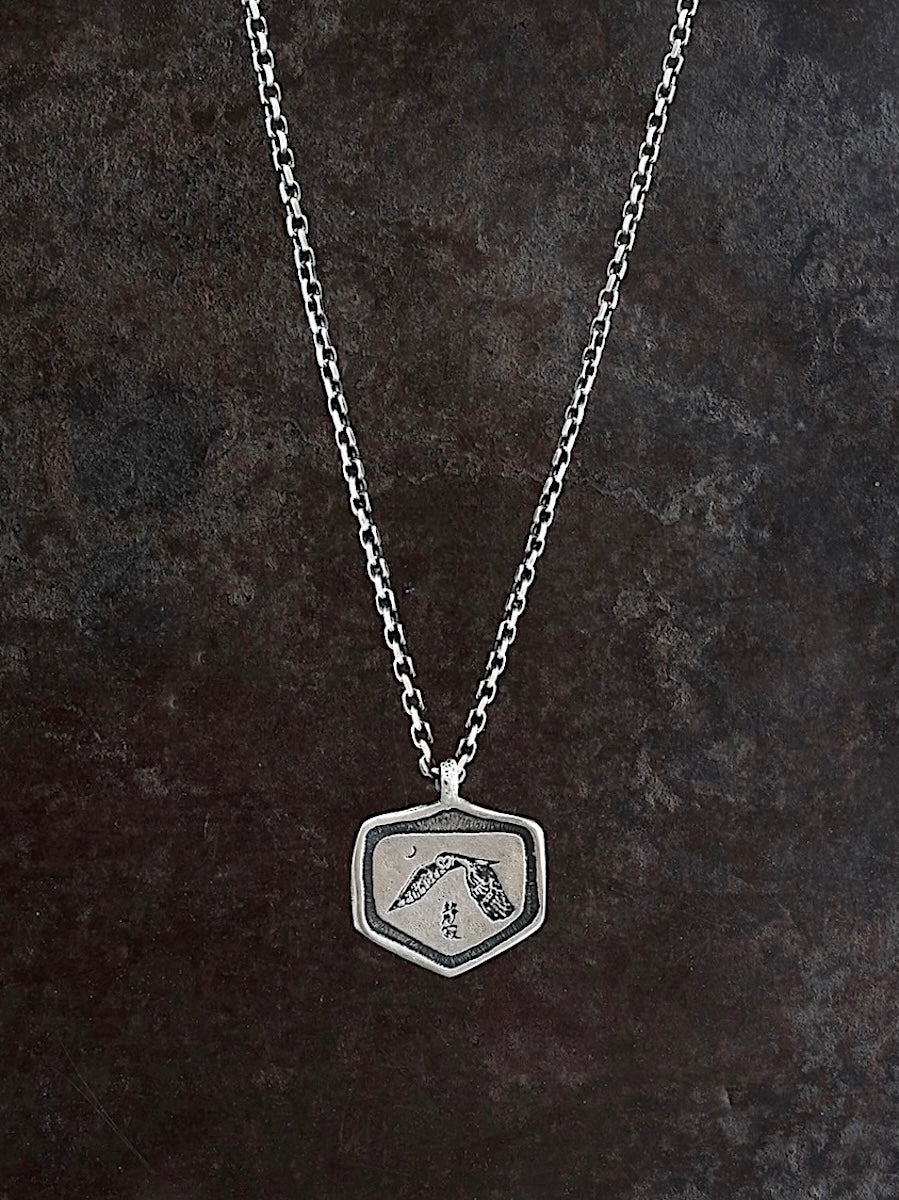 Sterling silver necklace with an etched sacred owl