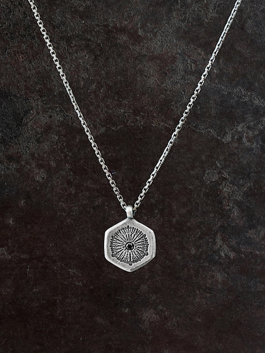 Coral etched silver pendant with a  diamond