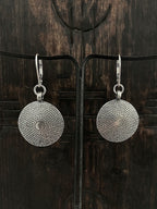 A pair of womens handcast sterling silver domed shield earrings 