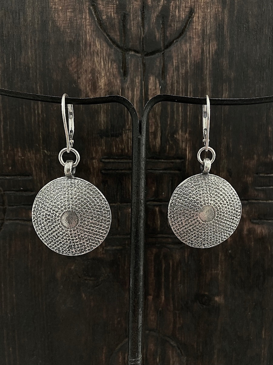A pair of womens handcast sterling silver domed shield earrings 