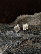A pair of textured leaf-shaped stud earrings made of aged sterling silver, mens jewelry womens jewelry